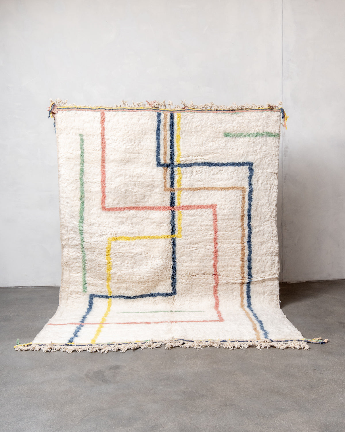Modern, designer, handcrafted Berber rug from Morocco. Beniourain carpet with beautiful colours and patterns and fluffy wool texture.